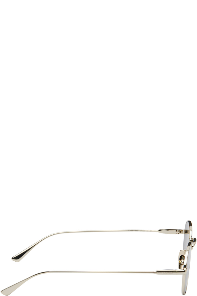 Round metal-frame sunglasses in gold tone.

· Gray lenses, category 3
· 100% UVA/UVB protection
· Adjustable metal nose pads
· Logo engraved at temples
· Includes case
· Size: 52.20 145

Supplier color: Light gold/Black