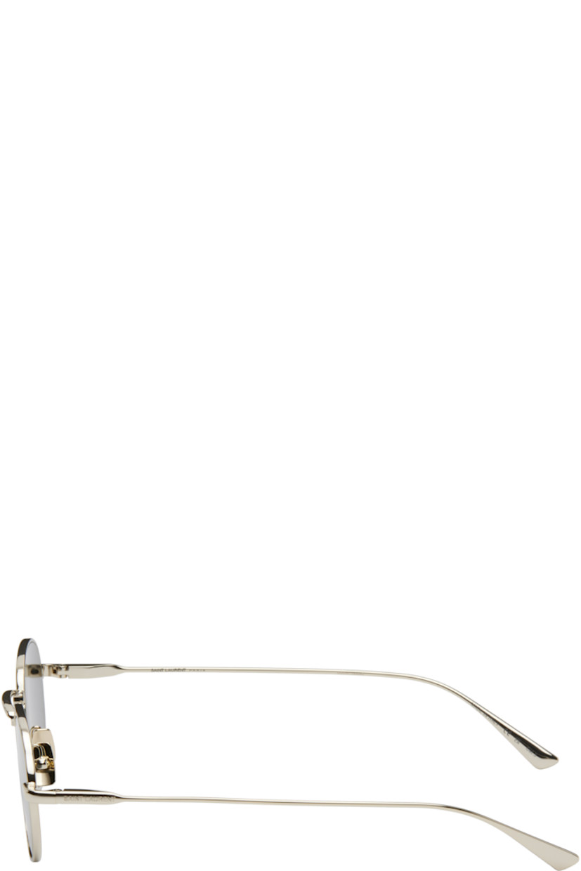 Round metal-frame sunglasses in gold tone.

· Gray lenses, category 3
· 100% UVA/UVB protection
· Adjustable metal nose pads
· Logo engraved at temples
· Includes case
· Size: 52.20 145

Supplier color: Light gold/Black