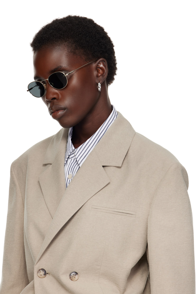 Round metal-frame sunglasses in gold tone.

· Gray lenses, category 3
· 100% UVA/UVB protection
· Adjustable metal nose pads
· Logo engraved at temples
· Includes case
· Size: 52.20 145

Supplier color: Light gold/Black
