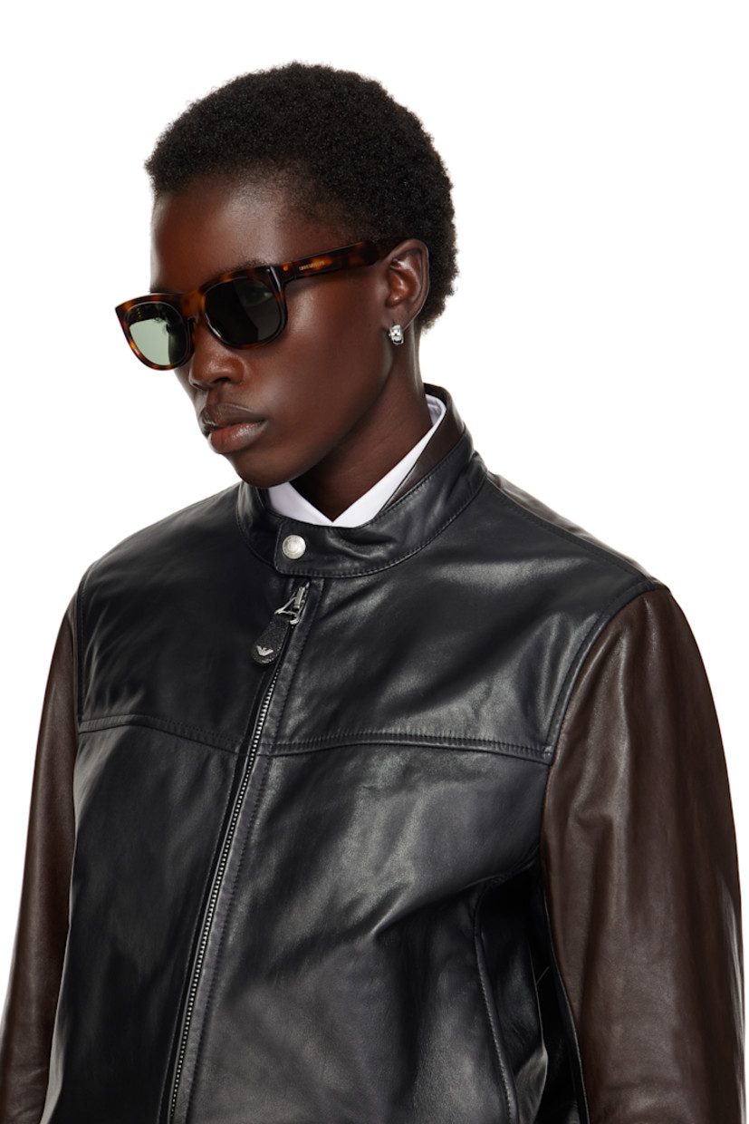 Oval tortoiseshell acetate-frame sunglasses in brown.

· Green lenses, category 2
· 100% UVA/UVB protection
· Integrated nose pads
· Logo stamp at temples
· Includes case
· Size: 56.20 145

Supplier color: Medium Havana/Green