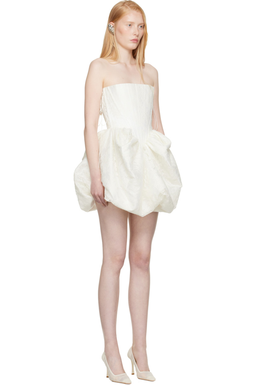 Cotton-blend twill minidress. Floral lace overlay. 

· Straight neck
· Boning at bodice
· Gathering at waist
· Bubble hem 
· Lace-up closure at side seams 

Part of the SSENSE Bridal capsule.

Supplier color: White/Ivory
