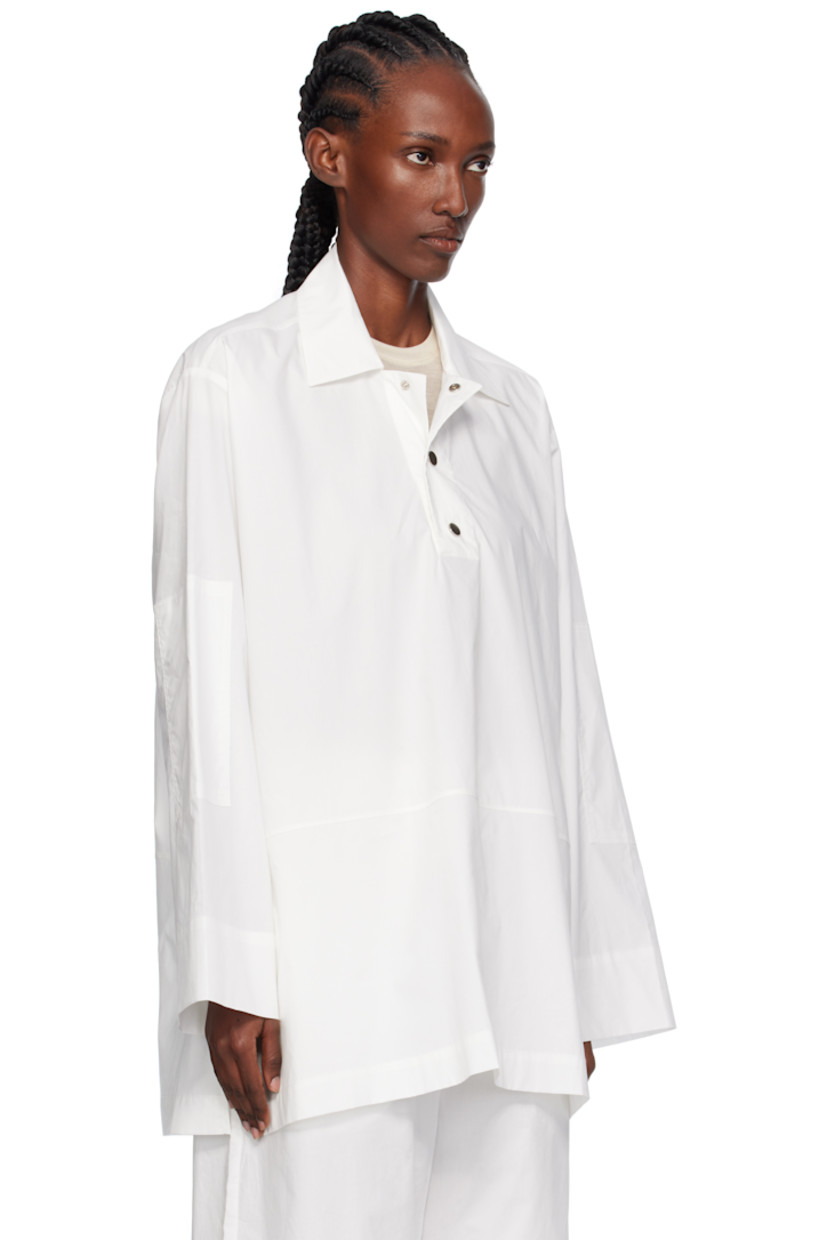Cotton poplin overshirt.

· Stand collar
· Press-stud placket
· Dropped shoulders

Supplier color: White