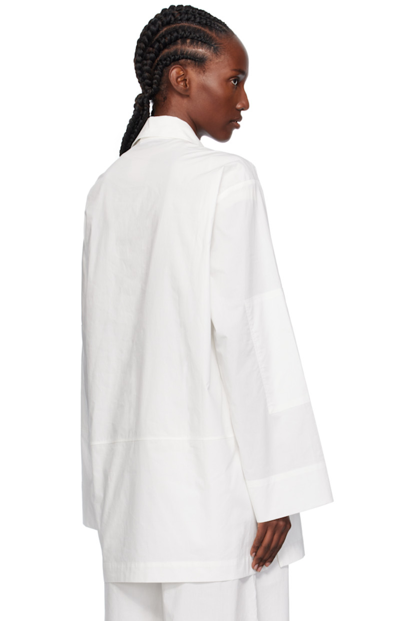 Cotton poplin overshirt.

· Stand collar
· Press-stud placket
· Dropped shoulders

Supplier color: White