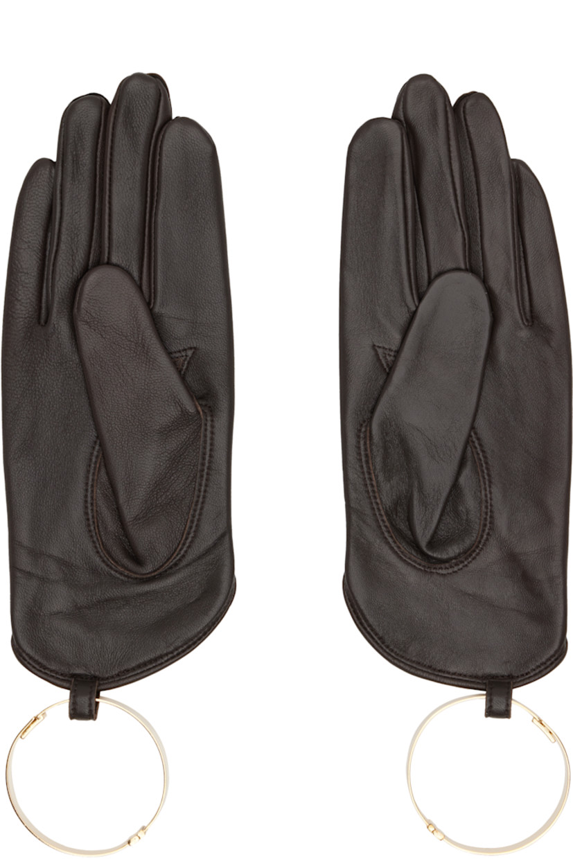 Pair of grained lambskin gloves.

· Bangle with magnetic fastening at cuffs
· Suede lining

Supplier color: Brown