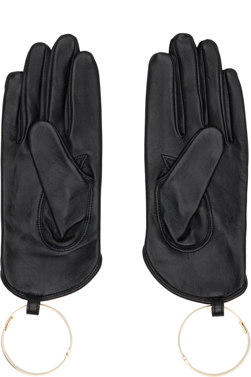 Pair of grained lambskin gloves. Detachable hinged bracelet in gold-tone brass.

Supplier color: Black