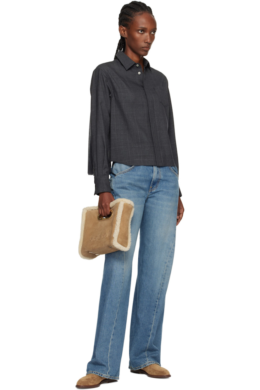 Shearling shoulder bag.

· Integrated carry handles
· Adjustable and detachable shoulder strap
· Logo appliqués at face and back
· Bumper studs at base
· Open throat
· Card slot at interior 
· H8.5" x W9.5" x D3"

Supplier color: Camel