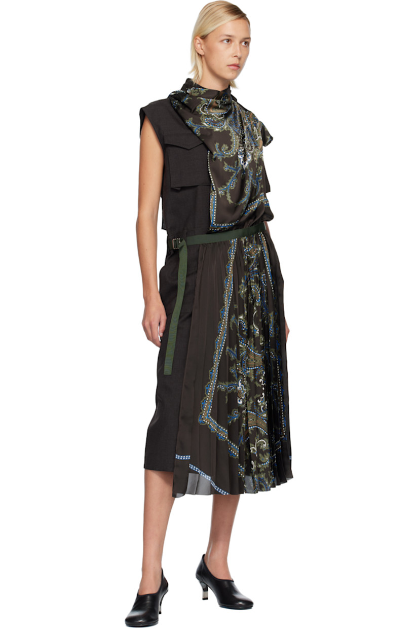 Plain-woven wool and satin midi dress. 

· Paneled wrap construction 
· Paisley pattern and pleats throughout 
· Mock neck
· Button closure
· Flap pocket at chest
· Belt loops and integrated cinch belt at waist
· Cap sleeves
· Two-pocket styling
· Central vent at back hem 

Supplier color: Brown/Khaki