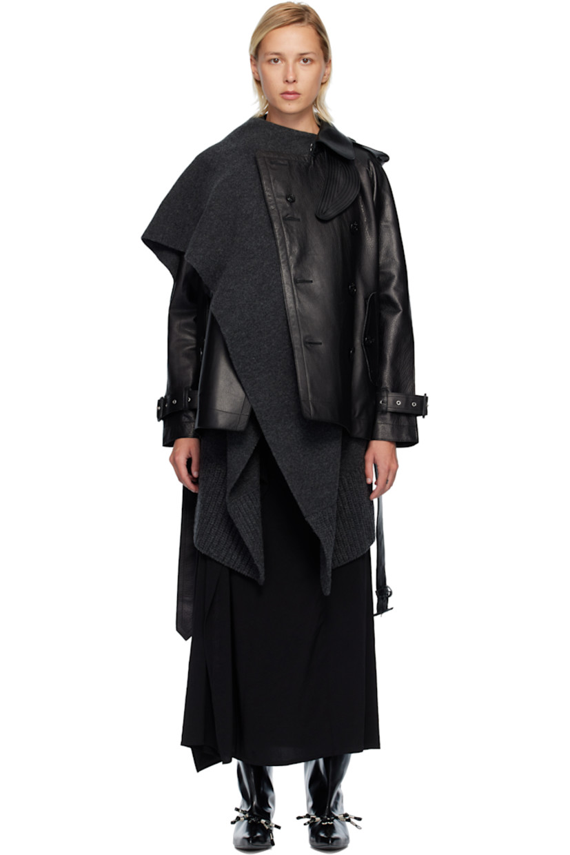 Grained leather jacket and insulated satin vest set. Vest features draped knit wool panels and two-way zip closure. Connecting press-studs at interior.

· Hook-eye fastening and throat guard at spread collar
· Double-breasted button closure
· Flap pockets at waist
· Detachable pin-buckle belt at hem
· Epaulets
· Raglan sleeves
· Pin-buckle tab at cuffs
· Storm flap and inverted box pleat at back
· Full satin lining

Supplier color: BlackxC/Gray