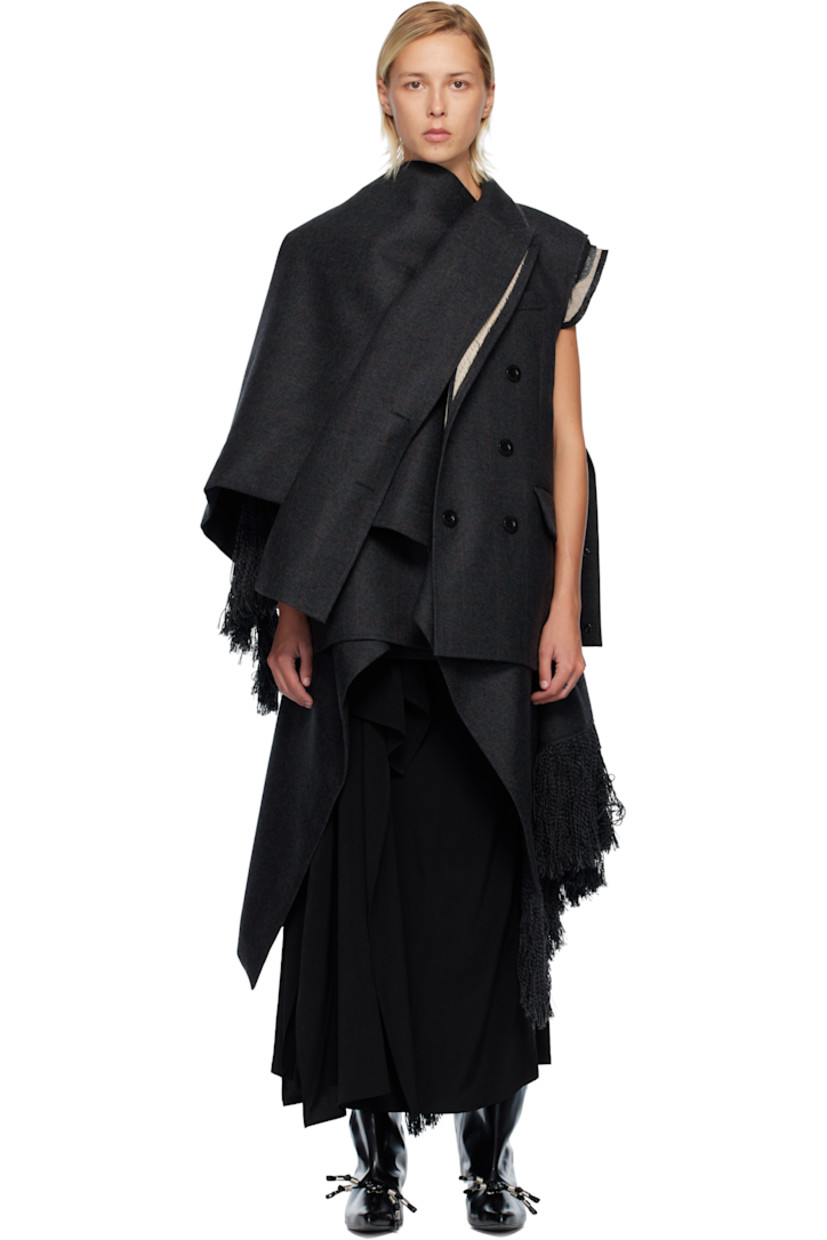 Double-faced wool melton vest. 

· Layered construction 
· Raw edges and check pattern throughout 
· Peaked lapels
· Double-breasted button closure
· Welt pocket at chest
· Flap pockets at waist
· Press-stud tabs at side seam
· Fringed detailing at asymmetric hem 

Supplier color: Gray