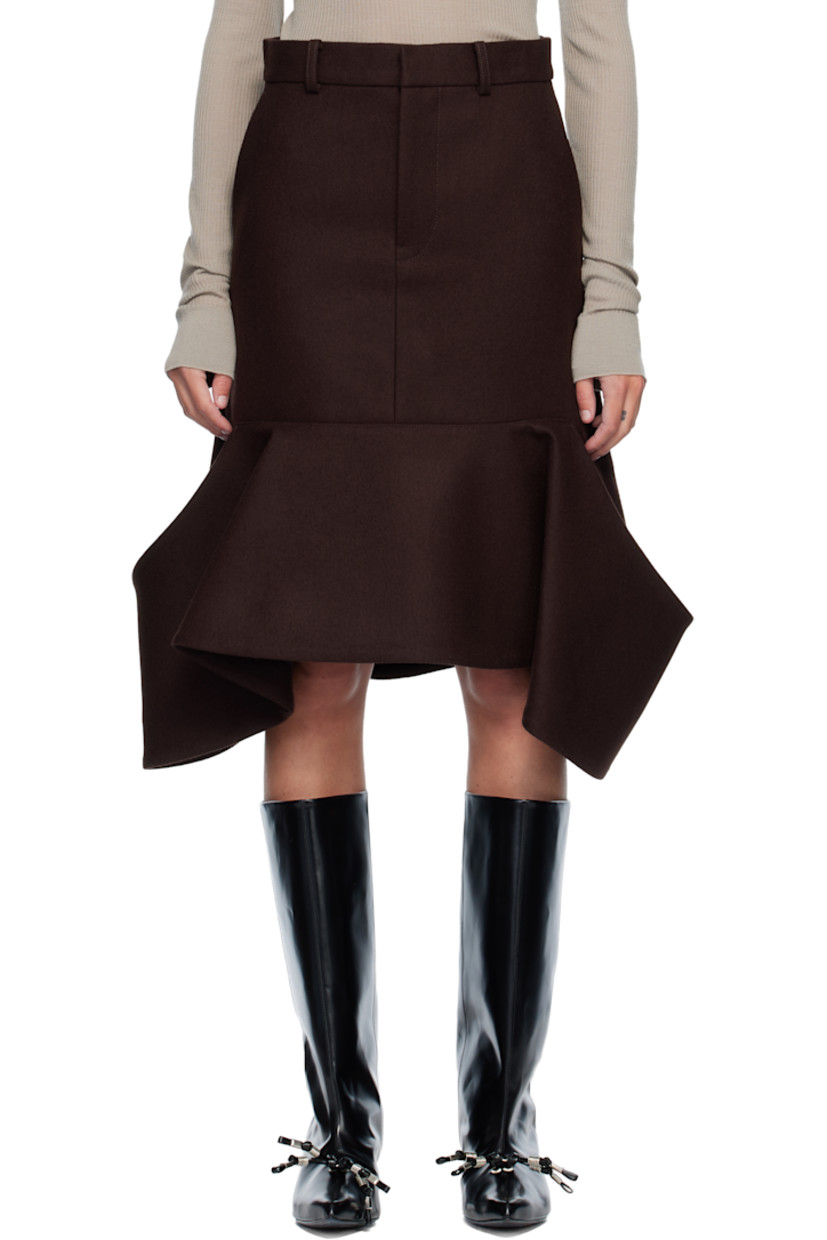 Wool melton midi skirt. 

· Belt loops
· Four-pocket styling
· Zip fly 
· Patch pockets at draped hem 

Supplier color: Brown