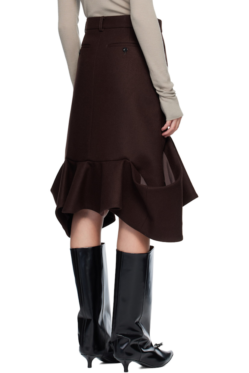 Wool melton midi skirt. 

· Belt loops
· Four-pocket styling
· Zip fly 
· Patch pockets at draped hem 

Supplier color: Brown