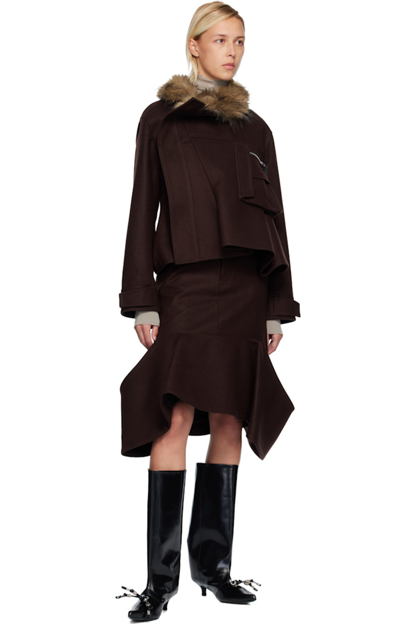 Wool melton midi skirt. 

· Belt loops
· Four-pocket styling
· Zip fly 
· Patch pockets at draped hem 

Supplier color: Brown