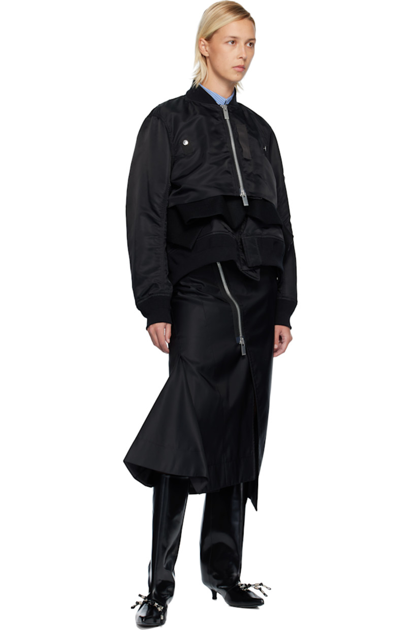 Nylon twill midi skirt. 

· Belt loops
· Two-pocket styling
· Exposed two-way zip fly 
· Vent at front hem
· Godet panels at hem 
· Cinch tab at back waistband
· Partial satin lining 

Supplier color: Black