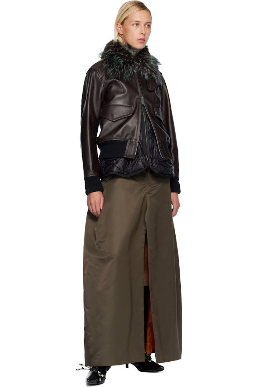 Nylon twill maxi skirt. 

· Belt loops
· Integrated cinch tabs at waistband 
· Four-pocket styling
· Zip fly 
· Cargo pocket at outseams 
· Central vent at front and back hem 

Supplier color: D/Khaki