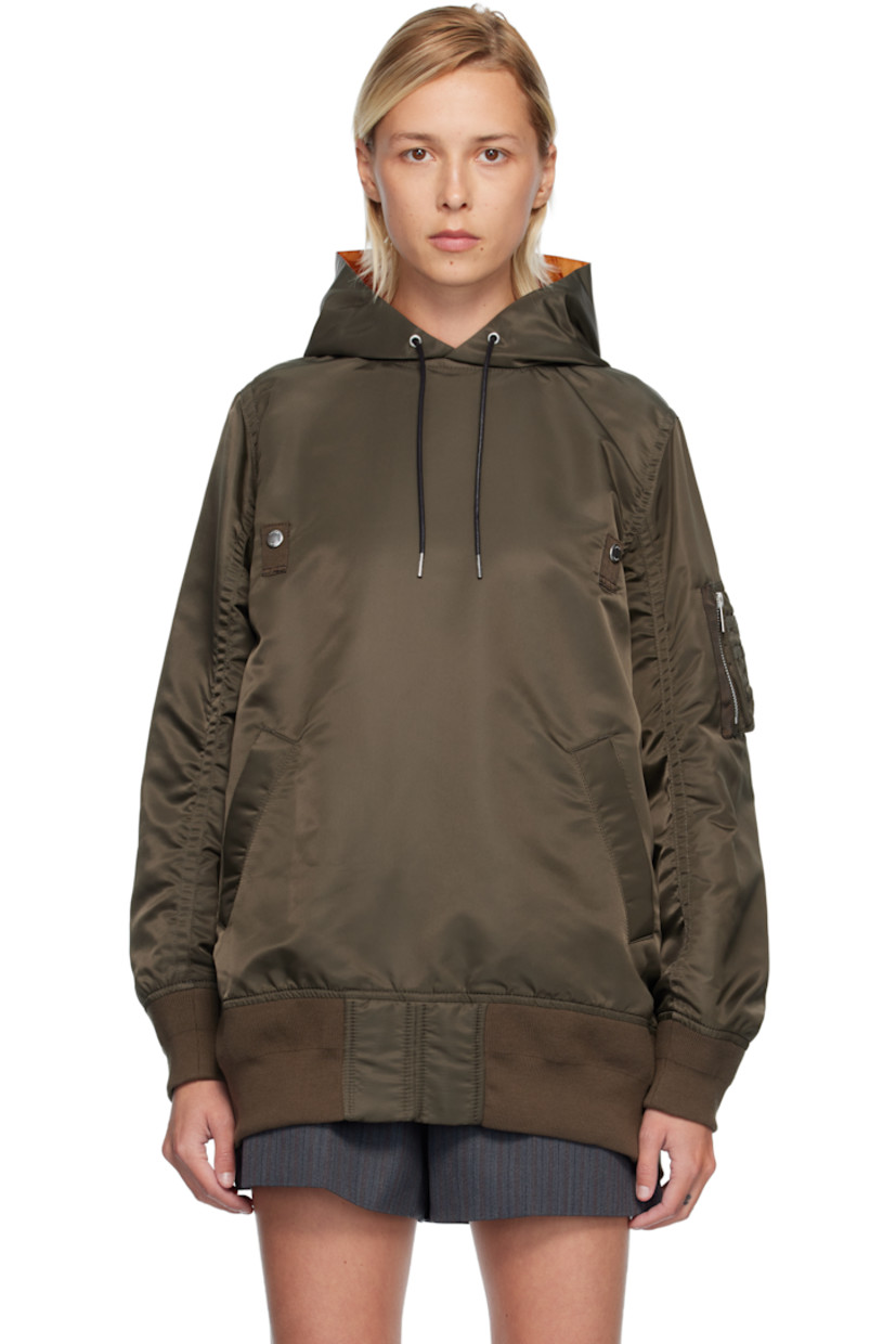 Nylon twill hoodie.

· Drawstring at hood 
· Press-stud tabs at chest
· Welt pockets at waist
· Rib-knit hem and cuffs
· Utility pocket and pen slots at sleeve
· Zip vent at back 
· Full satin lining 

Supplier color: D/Khaki