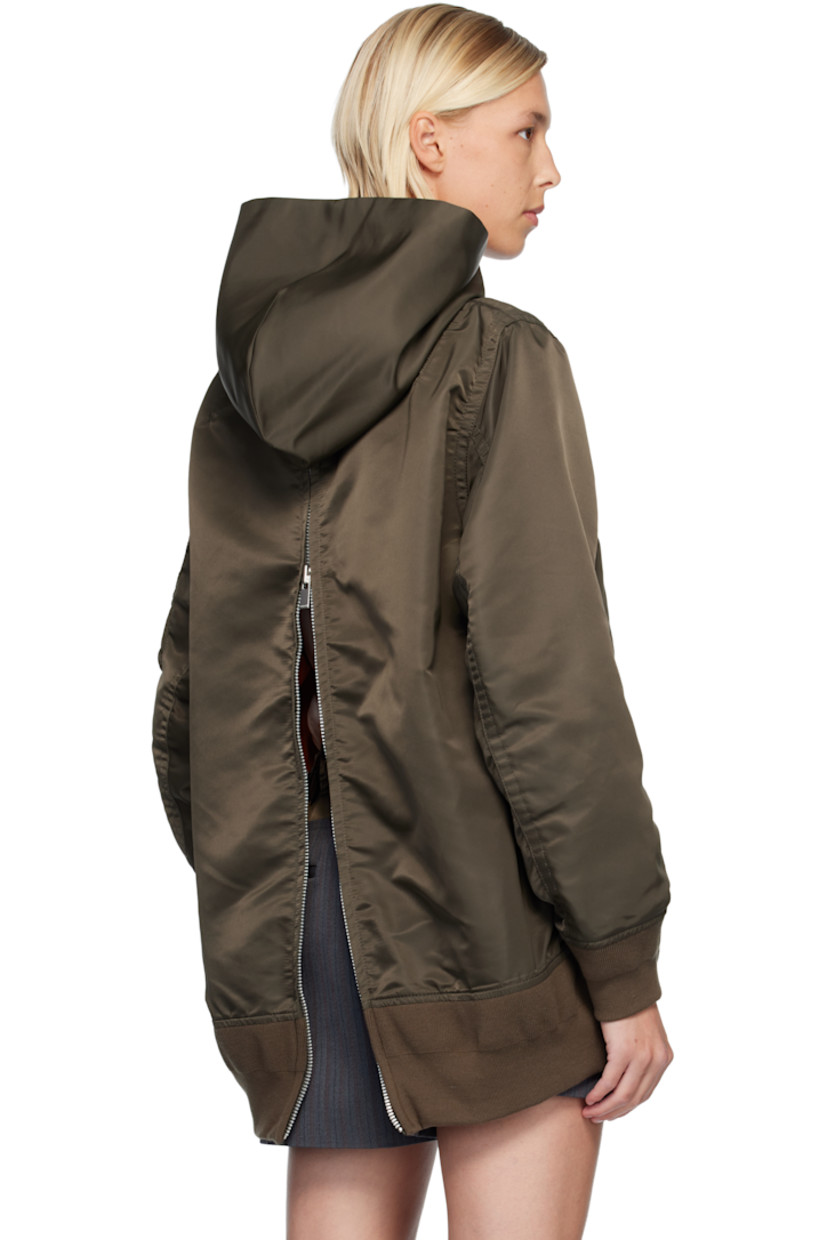 Nylon twill hoodie.

· Drawstring at hood 
· Press-stud tabs at chest
· Welt pockets at waist
· Rib-knit hem and cuffs
· Utility pocket and pen slots at sleeve
· Zip vent at back 
· Full satin lining 

Supplier color: D/Khaki