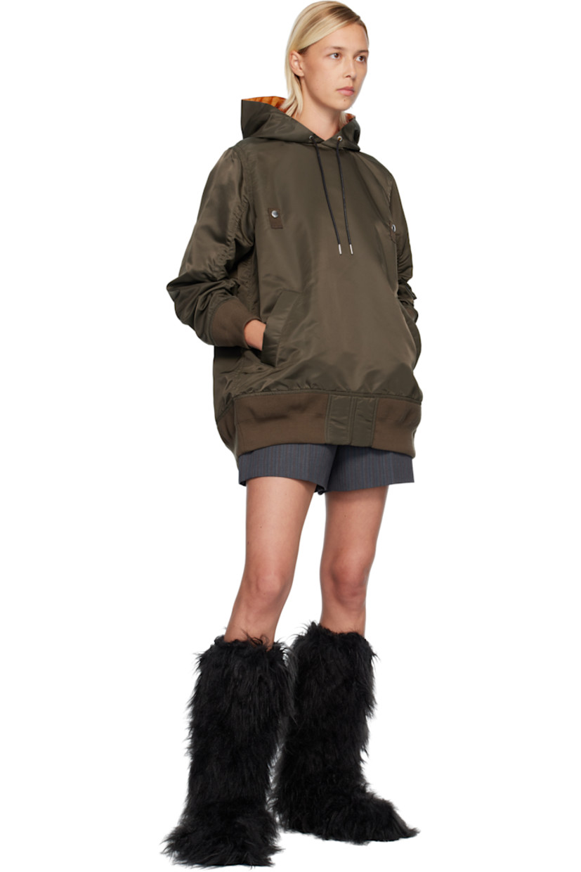 Nylon twill hoodie.

· Drawstring at hood 
· Press-stud tabs at chest
· Welt pockets at waist
· Rib-knit hem and cuffs
· Utility pocket and pen slots at sleeve
· Zip vent at back 
· Full satin lining 

Supplier color: D/Khaki