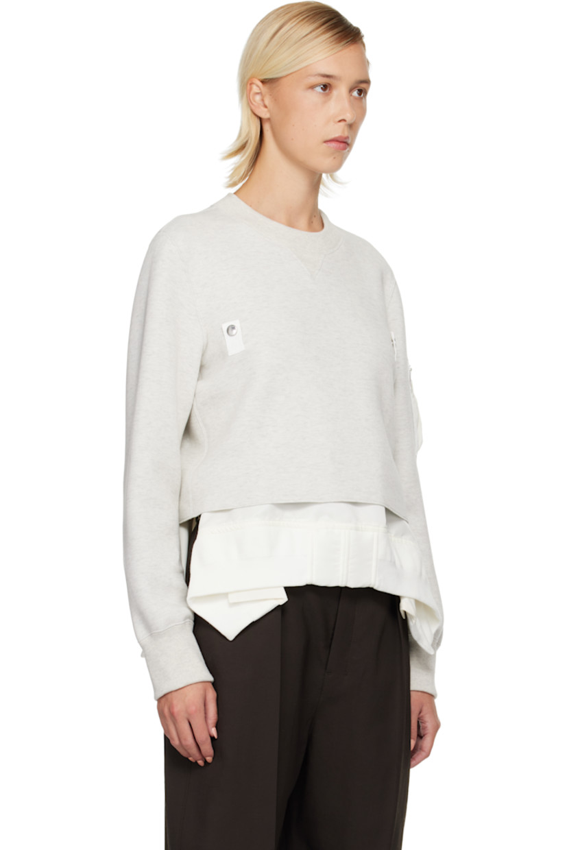 Heavyweight cotton-blend jersey sweatshirt. Integrated nylon satin underlay with rib-knit trim and vents at hem.

· Rib-knit crewneck and cuffs
· Press-stud tabs at chest
· Cropped hem
· Utility pocket at sleeve
· Partial mesh lining

Supplier color: Ecru/Off white