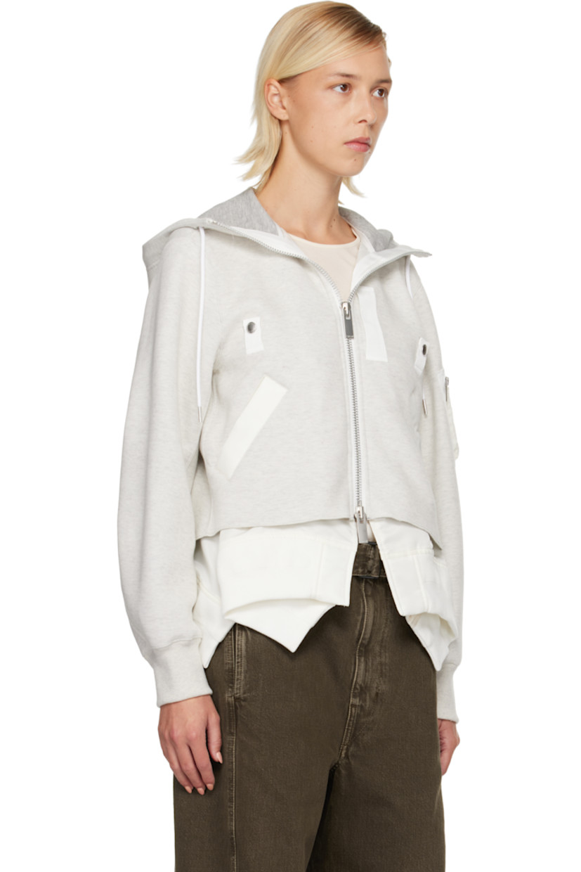 Heavyweight cotton-blend jersey hoodie. Integrated nylon satin underlay with rib-knit trim and vents at hem.

· Drawstring at hood
· Two-way zip closure
· Press-stud tabs at chest
· Welt pockets at waist
· Cropped hem
· Utility pocket at sleeve
· Rib-knit cuffs
· Partial mesh lining

Supplier color: Ecru/Off white