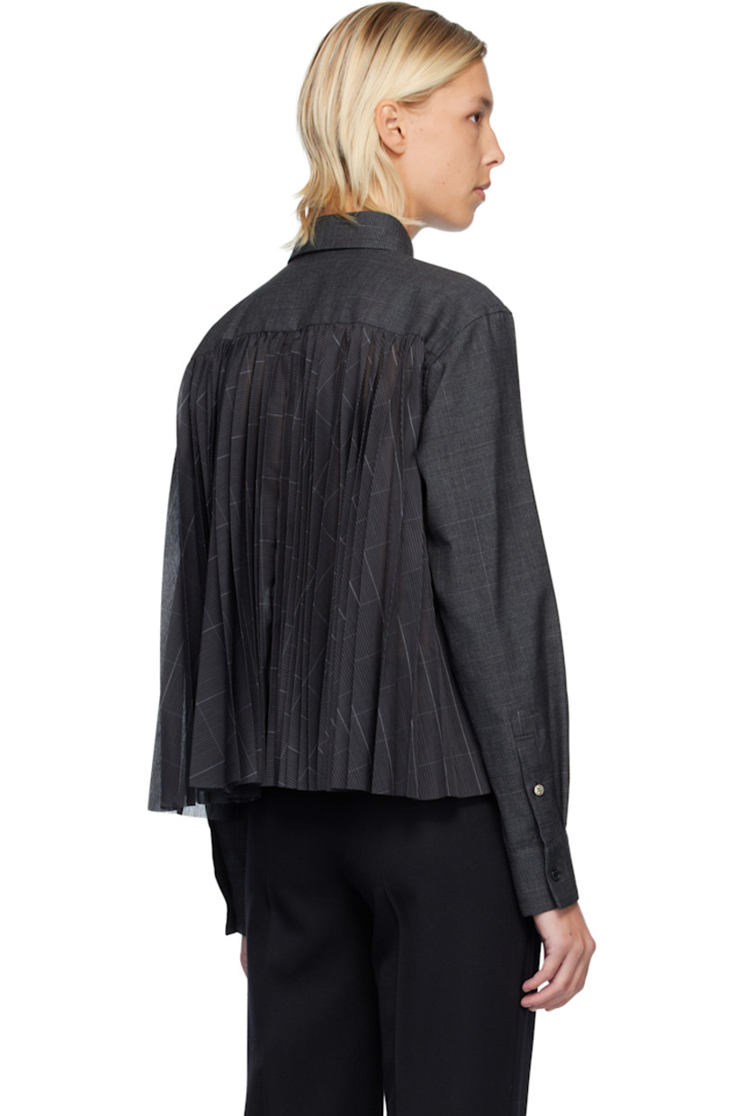 Plain-woven wool shirt. 

· Houndstooth pattern throughout 
· Spread collar 
· Button closure 
· Patch pocket at chest
· Pleats at buttoned barrel cuffs
· Pleats at chiffon back yoke 

Supplier color: Gray
