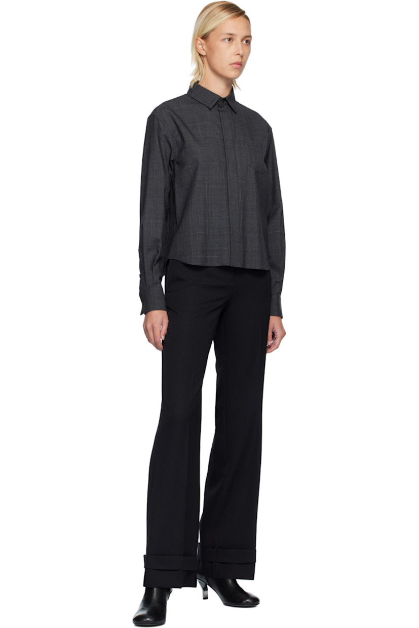 Plain-woven wool shirt. 

· Houndstooth pattern throughout 
· Spread collar 
· Button closure 
· Patch pocket at chest
· Pleats at buttoned barrel cuffs
· Pleats at chiffon back yoke 

Supplier color: Gray