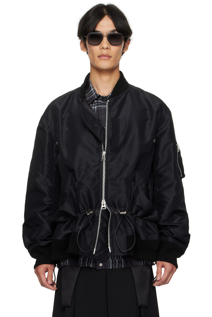 Insulated nylon satin twill bomber jacket. 

· Rib-knit stand collar, hem, and cuffs
· Two-way zip closure
· Webbing trim and logo-engraved rivets at chest 
· Welt pockets at front 
· Gathering and bungee-style drawstring at waist
· Utility pocket and pen slots at sleeve
· Full satin lining 

Supplier color: Black