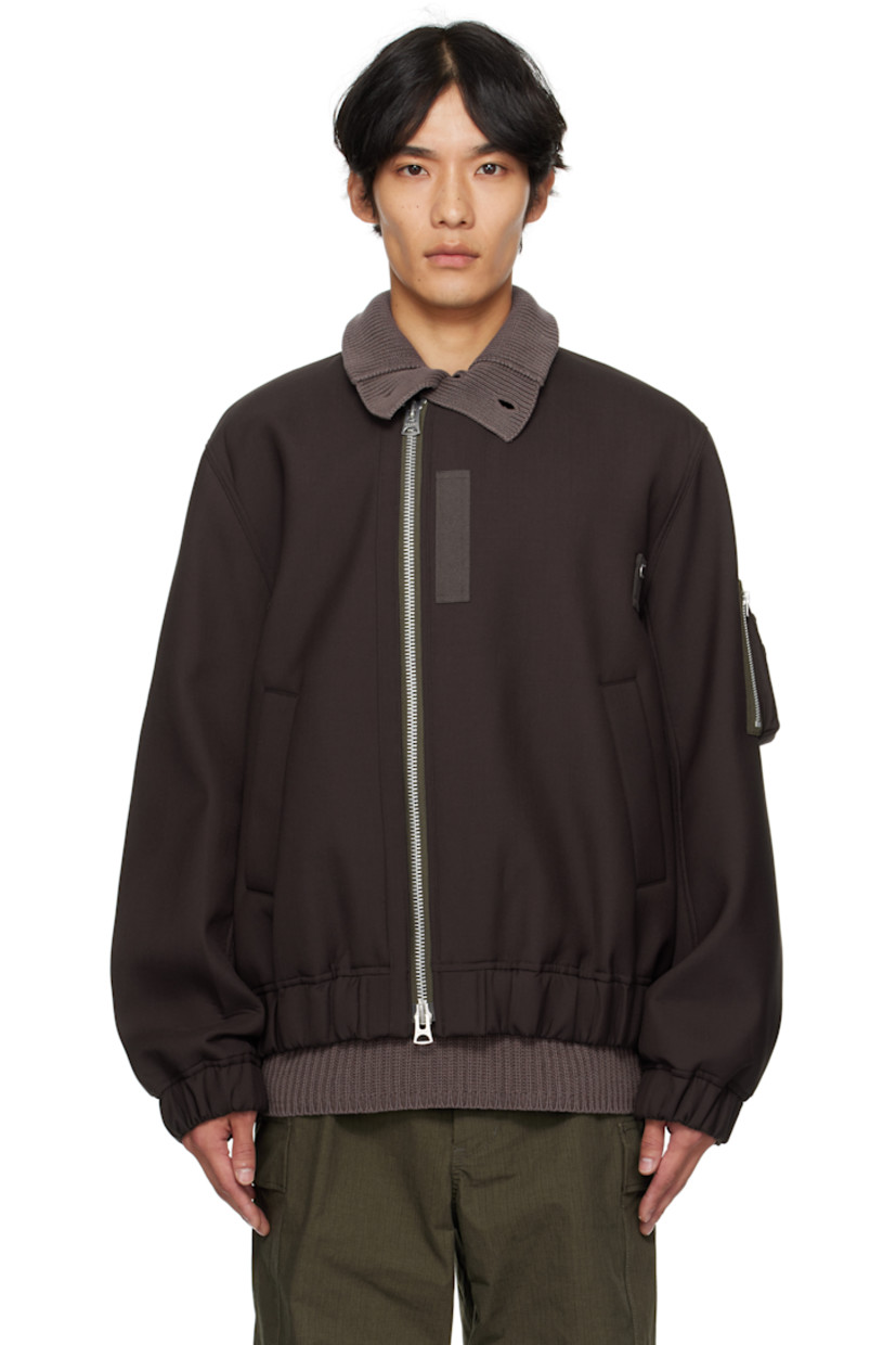 Insulated plain-woven wool-blend bomber jacket.

· Stand collar
· Offset two-way zip closure
· Press-stud tabs at chest
· Welt pockets at front
· Elasticized hem and cuffs
· Utility pocket at sleeve
· Full cupro satin lining

Supplier color: Brown