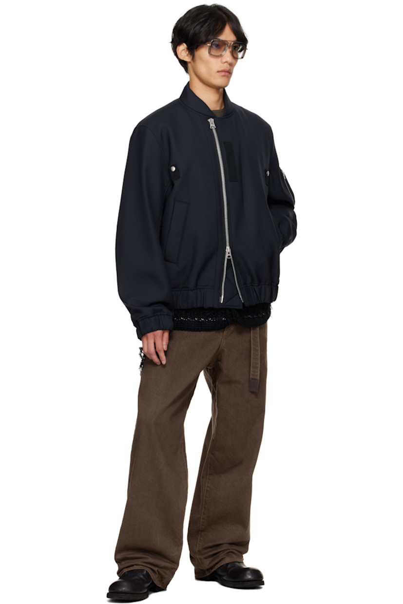 Insulated plain-woven wool-blend bomber jacket.

· Stand collar
· Offset two-way zip closure
· Press-stud tabs at chest
· Welt pockets at front
· Elasticized hem and cuffs
· Utility pocket at sleeve
· Full cupro satin lining

Supplier color: Navy