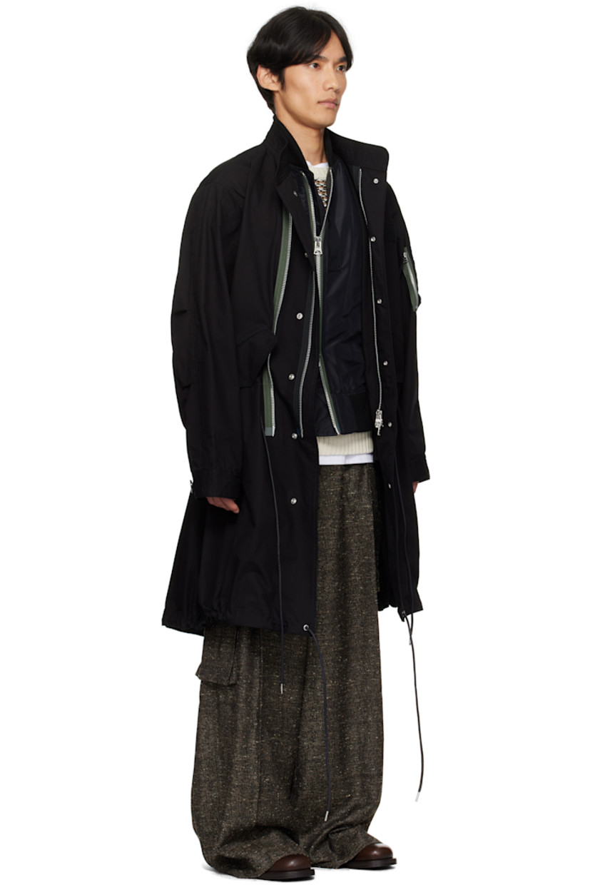 Padded cotton- and nylon-blend ripstop coat.

· Paneled construction 
· Stand collar with rib-knit underlay 
· Two-way zip closure and press-stud placket
· Webbing trim at chest
· Flap pockets at waist
· Drawstring at waist and hem 
· Rib-knit trim at hem 
· Utility pocket and pen slots at sleeve
· Button tab at cuffs
· Central vent at fishtail hem 
· Partial satin lining

Supplier color: Black