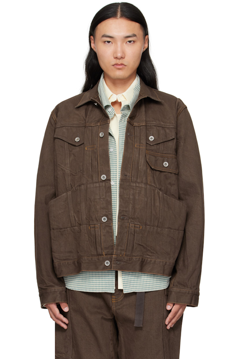 Crinkled non-stretch denim jacket.

· Pintucks throughout 
· Spread collar 
· Button closure
· Flap pockets at chest
· Patch pockets at waist
· Button tab at cuffs
· Paneled back yoke 
· Cinch tab at back 
· Contrast stitching in tan

Supplier color: Brown