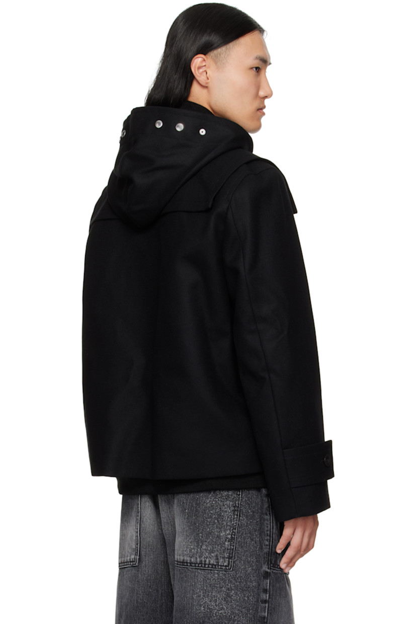 Wool melton and nylon twill bomber jacket.

· Layered and paneled construction 
· Throat guard and studs at hood
· Rib-knit stand collar, hem, and cuffs
· Toggle closure 
· Concealed two-way zip closure 
· Patch pockets and concealed welt pockets at waist 
· Press-stud vents at side seams 
· Button tabs at cuffs
· Inset rib-knit cuffs
· Fully lined

Supplier color: Black