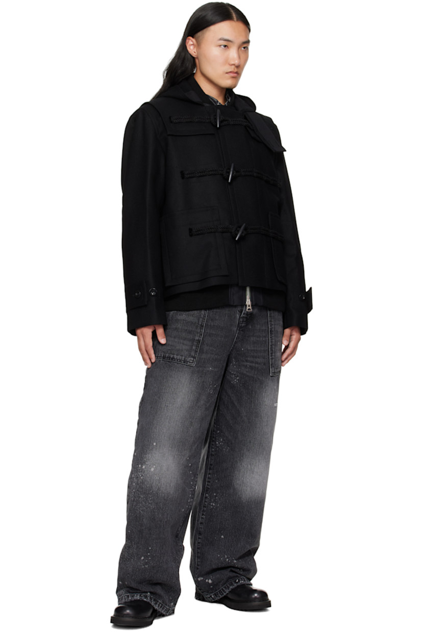 Wool melton and nylon twill bomber jacket.

· Layered and paneled construction 
· Throat guard and studs at hood
· Rib-knit stand collar, hem, and cuffs
· Toggle closure 
· Concealed two-way zip closure 
· Patch pockets and concealed welt pockets at waist 
· Press-stud vents at side seams 
· Button tabs at cuffs
· Inset rib-knit cuffs
· Fully lined

Supplier color: Black