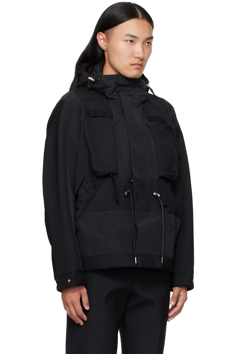 Wool-blend broadcloth and grosgrain jacket. 

· Paneled construction 
· Cord-lock drawstring at hood, waist, and hem 
· Concealed two-way zip closure and press-stud placket
· Webbing daisy chain at chest
· Zip pockets at chest
· Welt pockets at waist
· Elasticized cuffs
· Full satin lining 

Supplier color: Black