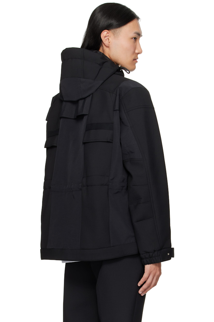Wool-blend broadcloth and grosgrain jacket. 

· Paneled construction 
· Cord-lock drawstring at hood, waist, and hem 
· Concealed two-way zip closure and press-stud placket
· Webbing daisy chain at chest
· Zip pockets at chest
· Welt pockets at waist
· Elasticized cuffs
· Full satin lining 

Supplier color: Black