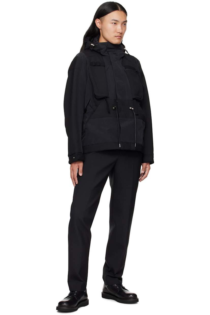 Wool-blend broadcloth and grosgrain jacket. 

· Paneled construction 
· Cord-lock drawstring at hood, waist, and hem 
· Concealed two-way zip closure and press-stud placket
· Webbing daisy chain at chest
· Zip pockets at chest
· Welt pockets at waist
· Elasticized cuffs
· Full satin lining 

Supplier color: Black