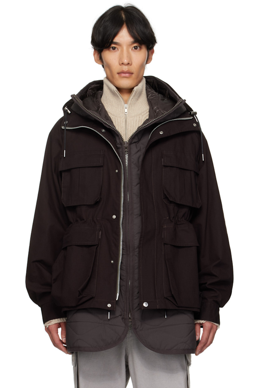 Cotton- and nylon-blend ripstop coat. 

· Paneled and layered construction 
· Bungee-style drawstring at hood and waist
· Two-way zip closure and press-stud placket
· Bellows  pockets at front
· Raglan sleeves
· Press-stud tab at cuffs
· Zip gusset at back
· Quilted polyester ripstop underlay 
· Full satin lining

Supplier color: Brown