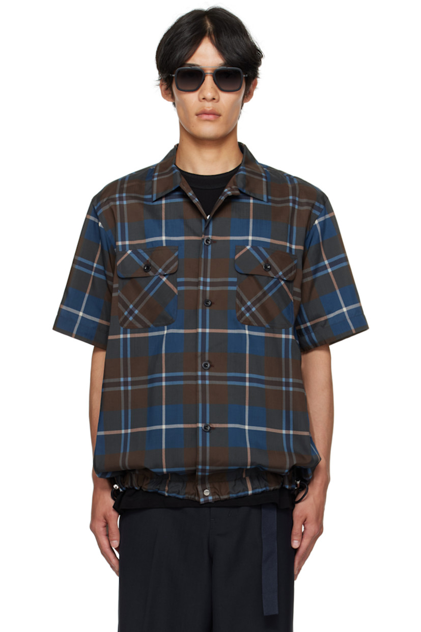 Satin shirt.

· Check pattern throughout
· Spread collar
· Button closure
�· Flap pockets at chest
· Cord-lock drawstring at hem
· Pleats at back yoke

Supplier color: Brown/Blue