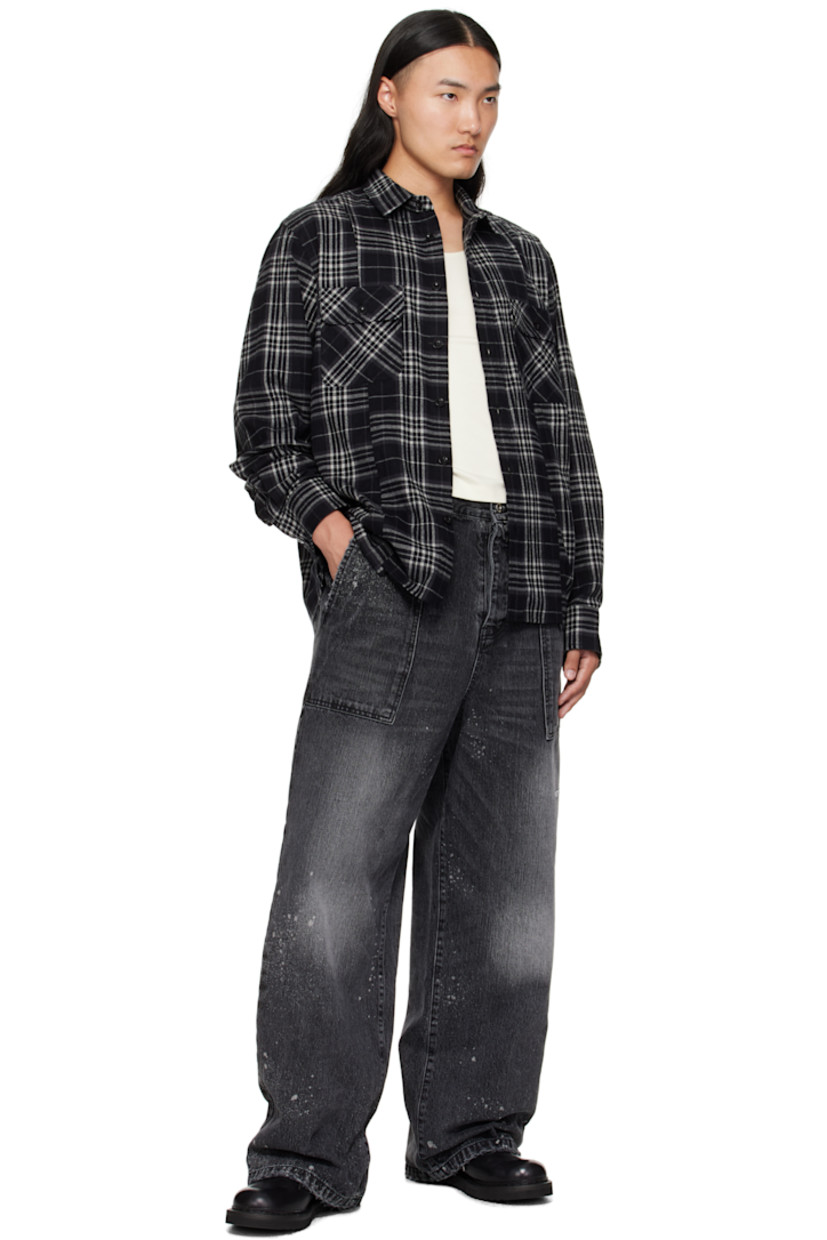 Cotton flannel shirt. 

· Check pattern throughout 
· Spread collar 
· Button closure
· Flap pockets at chest
· Asymmetric shirttail hem
· Pleats at buttoned barrel cuffs
· Box pleat at back yoke

Supplier color: Black