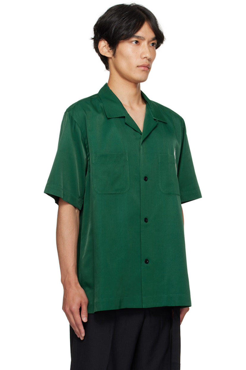 Rayon- and cotton-blend twill shirt.

· Spread collar
· Button closure
· Patch pockets and embroidered graphic at chest
· Vented side seams
· Text embroidered at back

Part of the Where The Wild Things Are capsule.

Supplier color: Green