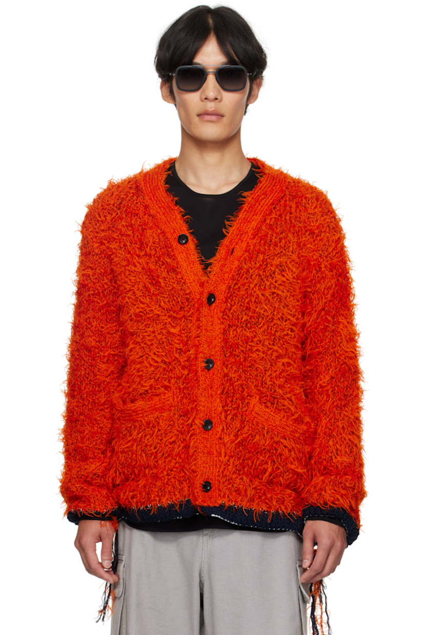 Shag-knit cardigan. 

· Rib-knit Y-neck, hem, and cuffs
· Button closure
· Welt pockets at front 
· Loose thread detailing at side seams and cuffs
· Contrast stitching in white 

Supplier color: Orange