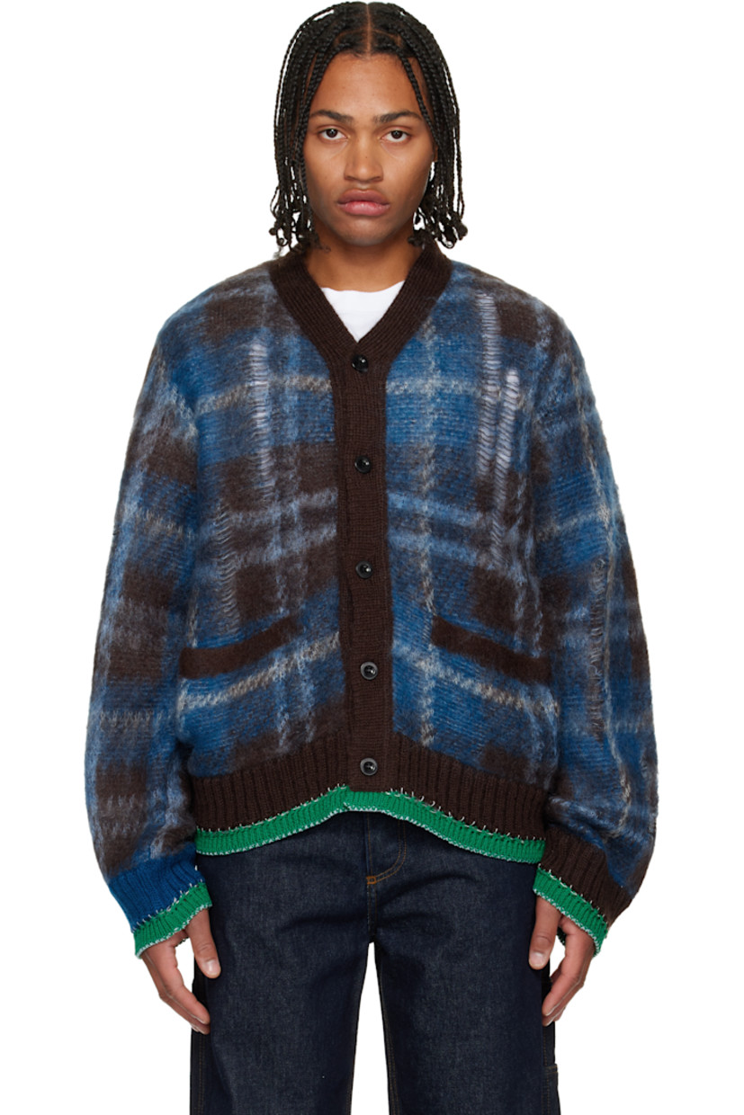 Brushed knit mohair-blend cardigan.

· Check pattern and distressing throughout
· Rib-knit Y-neck, hem, and cuffs
· Button closure
· Welt pockets at front
· Blanket stitching at hem and cuffs

Supplier color: Brown/Blue