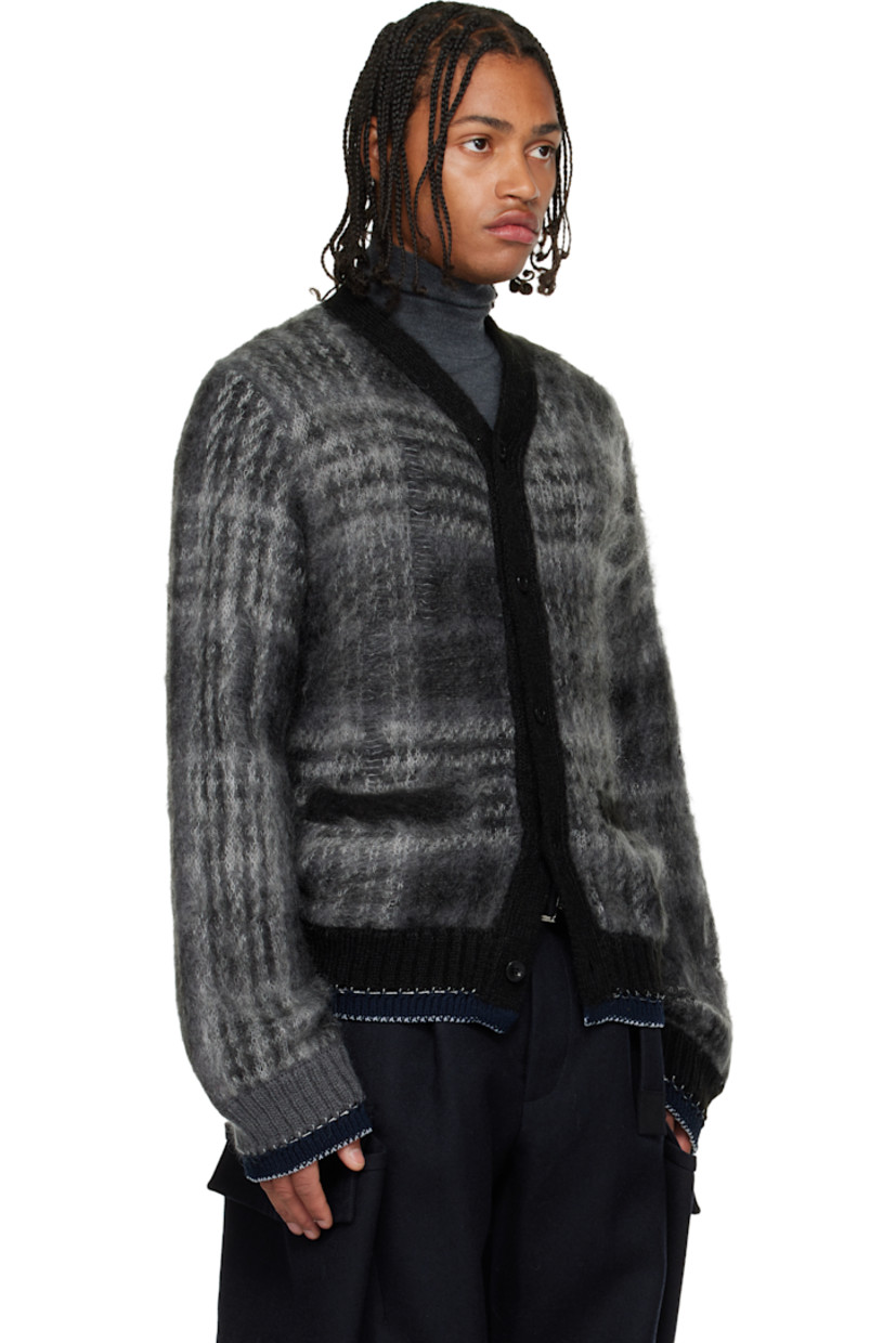 Brushed knit mohair-blend cardigan.

· Check pattern and distressing throughout
· Rib-knit Y-neck, hem, and cuffs
· Button closure
· Welt pockets at front
· Blanket stitching at hem and cuffs

Supplier color: Black