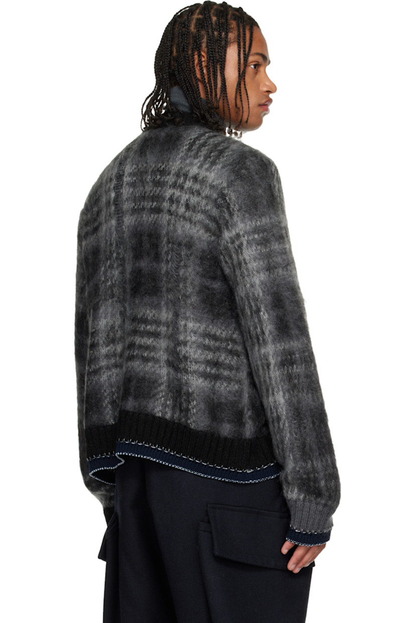Brushed knit mohair-blend cardigan.

· Check pattern and distressing throughout
· Rib-knit Y-neck, hem, and cuffs
· Button closure
· Welt pockets at front
· Blanket stitching at hem and cuffs

Supplier color: Black