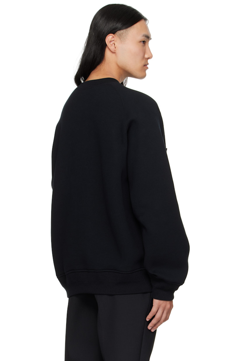 Double-faced cotton-blend fleece sweater. 

· Rib-knit crewneck, hem, and cuffs 
· Logo-engraved press-stud tab at chest
· Nylon twill trim at front hem 
· Dropped shoulders
· Utility pocket and pen slots at sleeve

Supplier color: Black