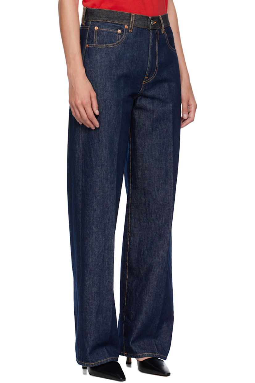 Non-stretch denim jeans. 

· Fading throughout
· Belt loops at navy denim waistband
· Five-pocket styling
· Zip fly
· Leather logo patch at back waistband
· Contrast stitching in tan

Supplier color: Raw rinsed