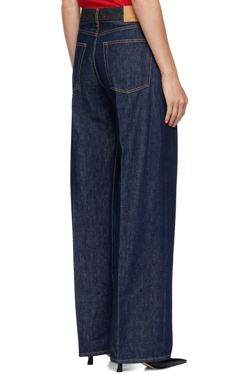 Non-stretch denim jeans. 

· Fading throughout
· Belt loops at navy denim waistband
· Five-pocket styling
· Zip fly
· Leather logo patch at back waistband
· Contrast stitching in tan

Supplier color: Raw rinsed