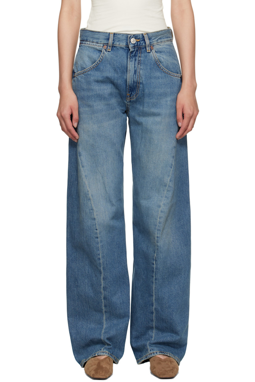Non-stretch denim jeans.

· Fading and whiskering throughout
· Wide-leg
· Mid-rise
· Belt loops
· Five-pocket styling
· Zip fly
· Twisted inseams and outseams
· Subtle distressing at cuffs
· Adjustable cinch tab at back waistband
· Logo patch at back waistband
· Contrast stitching in beige

Supplier color: Soft mid blue