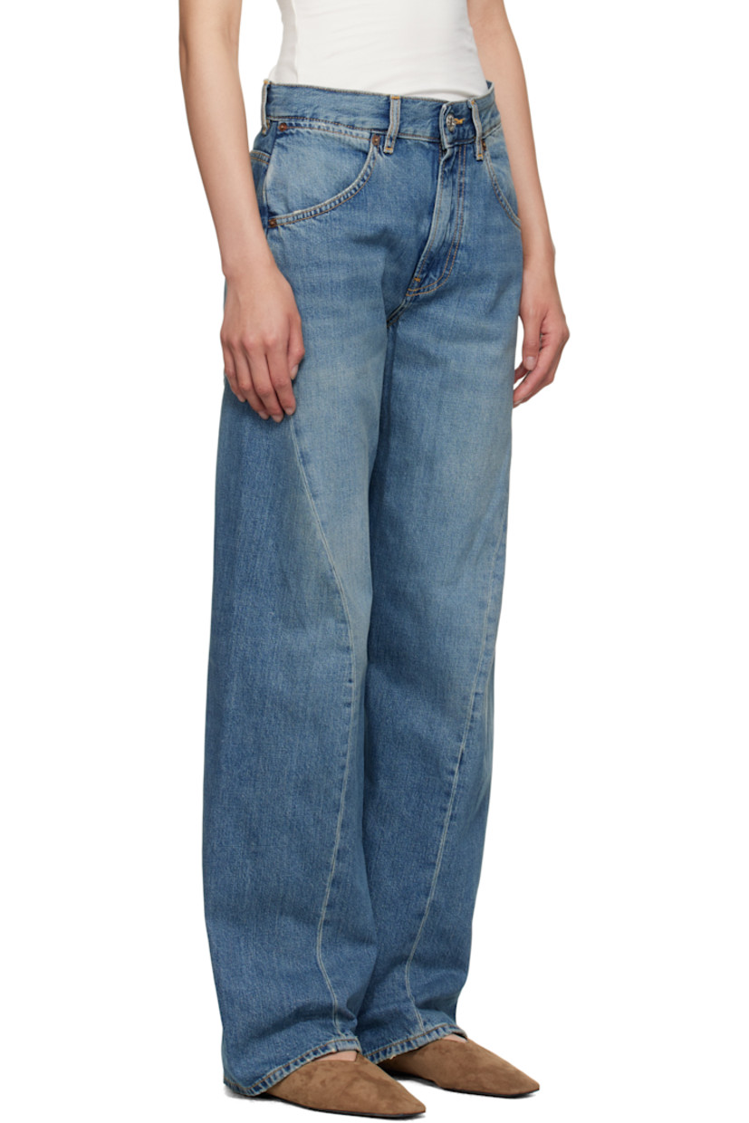 Non-stretch denim jeans.

· Fading and whiskering throughout
· Wide-leg
· Mid-rise
· Belt loops
· Five-pocket styling
· Zip fly
· Twisted inseams and outseams
· Subtle distressing at cuffs
· Adjustable cinch tab at back waistband
· Logo patch at back waistband
· Contrast stitching in beige

Supplier color: Soft mid blue