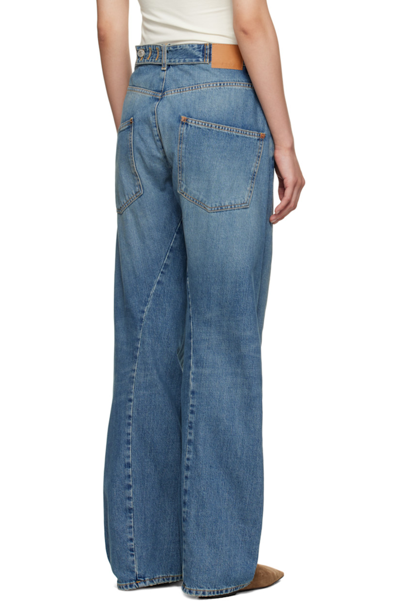 Non-stretch denim jeans.

· Fading and whiskering throughout
· Wide-leg
· Mid-rise
· Belt loops
· Five-pocket styling
· Zip fly
· Twisted inseams and outseams
· Subtle distressing at cuffs
· Adjustable cinch tab at back waistband
· Logo patch at back waistband
· Contrast stitching in beige

Supplier color: Soft mid blue