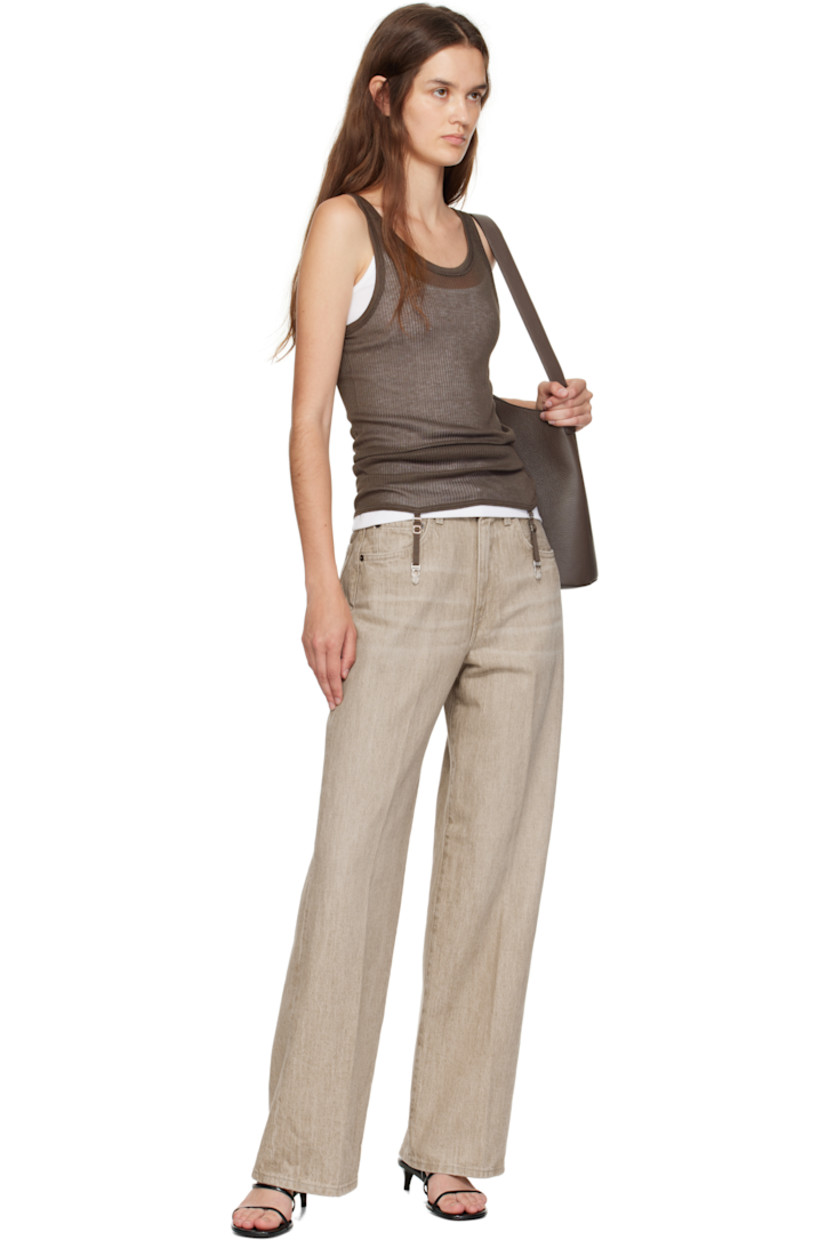 Wide straight-leg non-stretch denim jeans. 

· Fading and whiskering throughout 
· Mid-rise 
· Belt loops 
· Five-pocket styling
· Leather logo patch at back waistband 

Supplier color: Sanded quartz